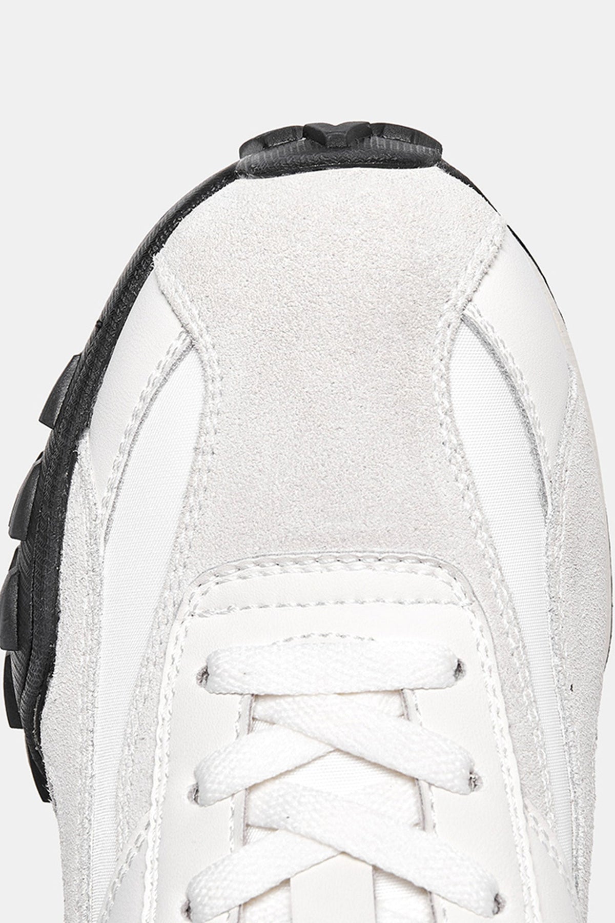 Delta Cross Beige — construction detail close-up